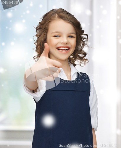 Image of pre-teen girl showing thumbs up