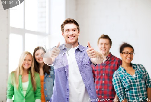 Image of student with group of students at school