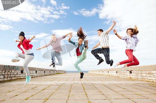 Image of group of teenagers jumping