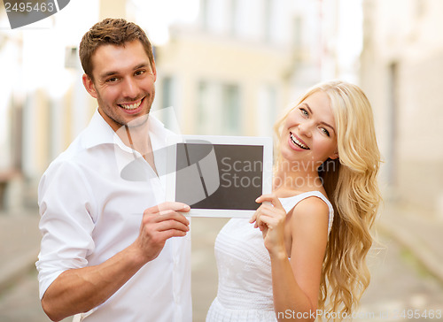 Image of couple with tablet pc in the city