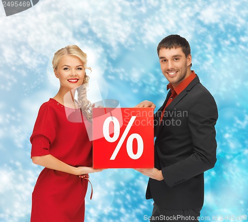 Image of man and woman with percent sign