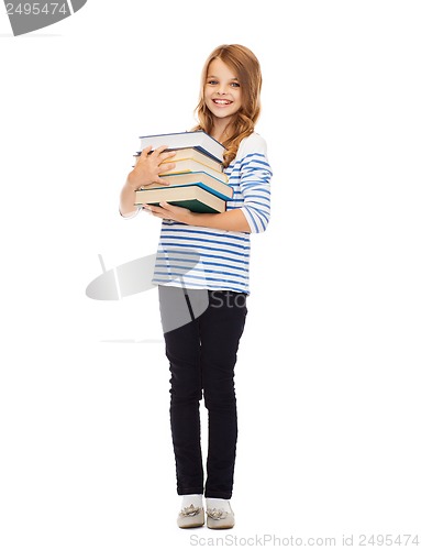 Image of little student girl with many books