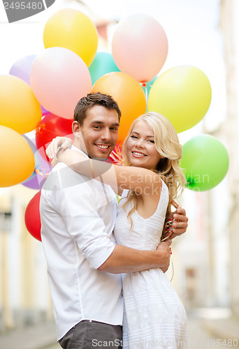 Image of couple with colorful balloons