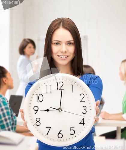 Image of student showing clock