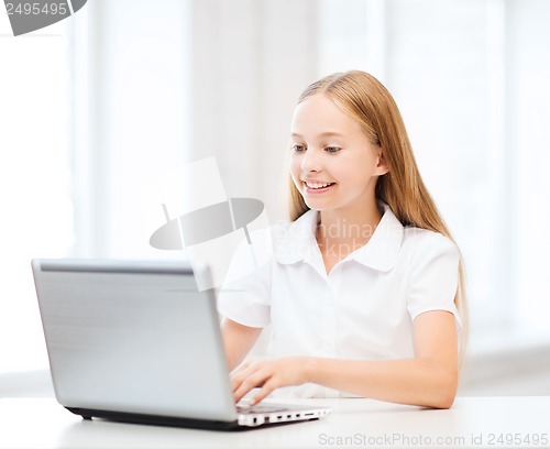 Image of girl with laptop pc at school