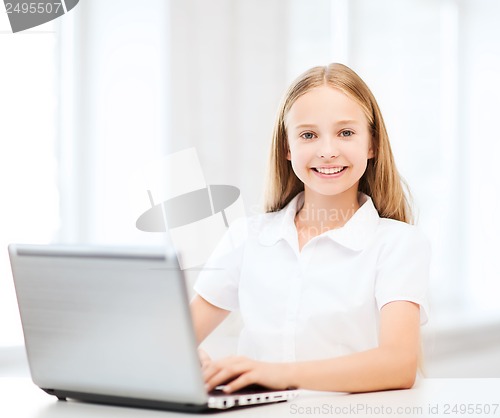 Image of girl with laptop pc at school