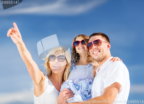Image of happy family with blue sky