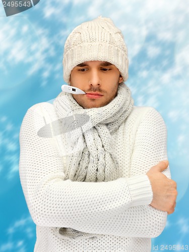 Image of sick man with thermometer in his mouth