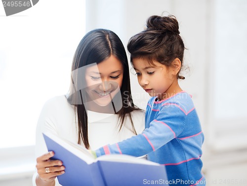 Image of mother and daughter with book