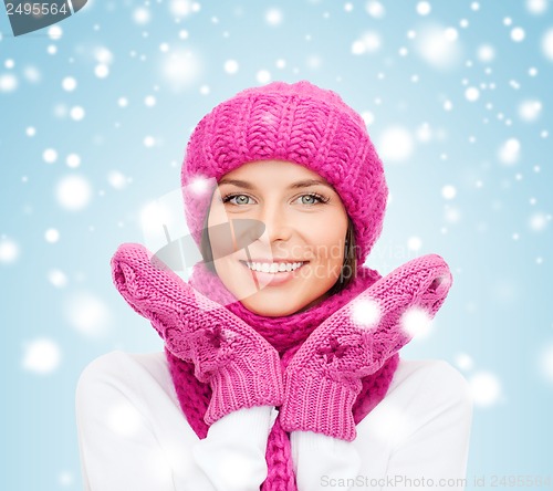 Image of woman in hat, muffler and mittens