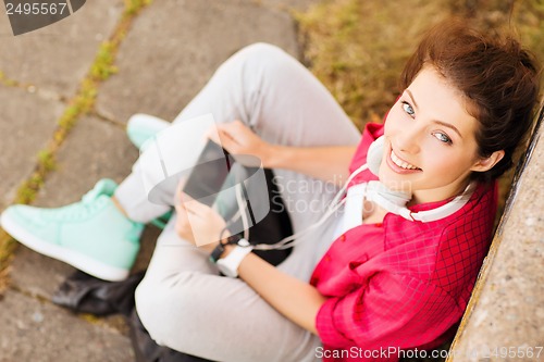 Image of girl with headphones listening to music