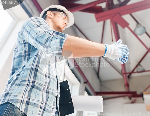 Image of man with blueprint