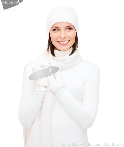 Image of woman in hat, muffler and gloves