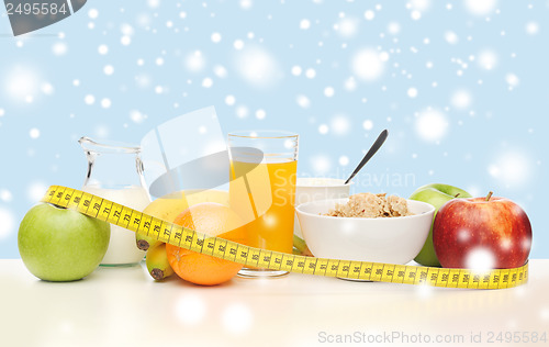 Image of healthy breakfast and measuring tape