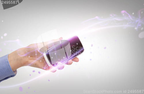Image of woman hand with smartphone
