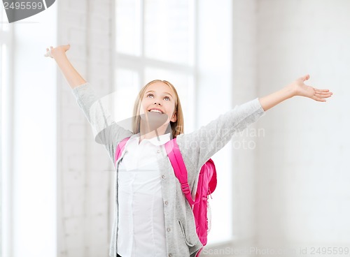 Image of student girl with hands up at school