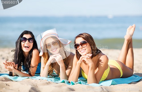 Image of girls sunbathing on the beach