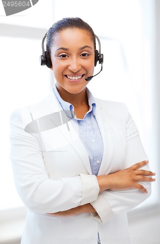 Image of african helpline operator with headphones