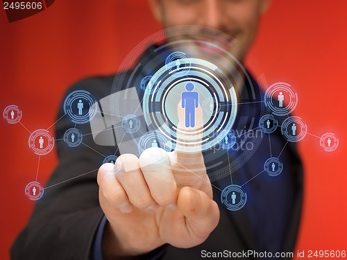 Image of businessman pressing button with contact