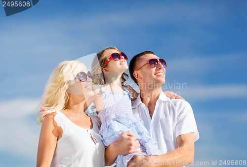 Image of happy family with blue sky