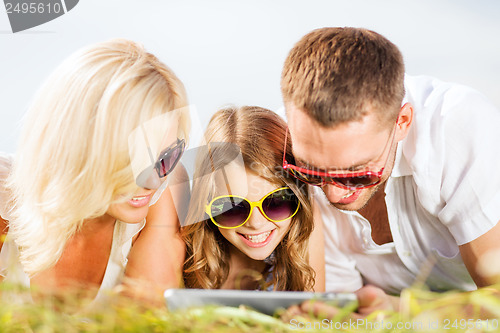 Image of happy family with tablet pc taking picture