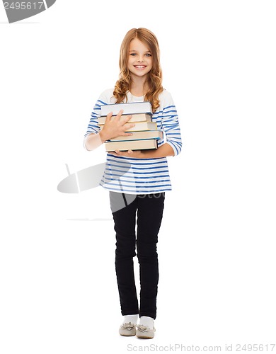 Image of little student girl with many books