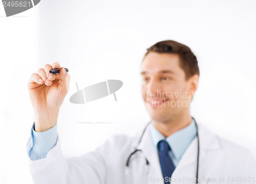 Image of doctor writing something in the air