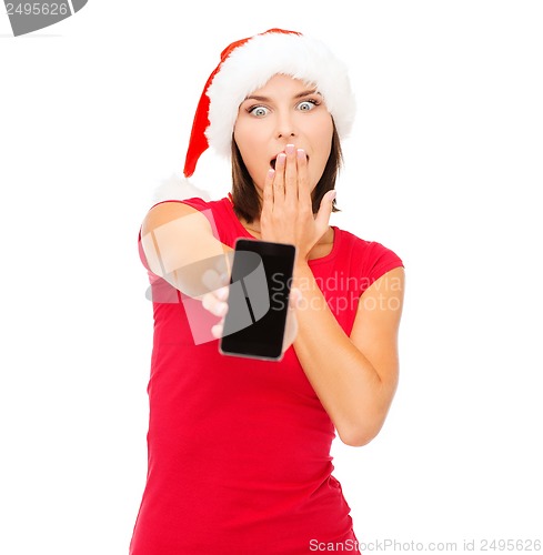 Image of woman in santa helper hat with smartphone