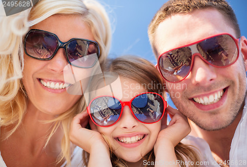 Image of happy family with blue sky