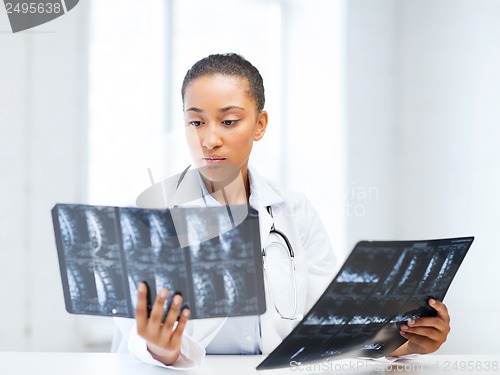 Image of african doctor looking at x-rays