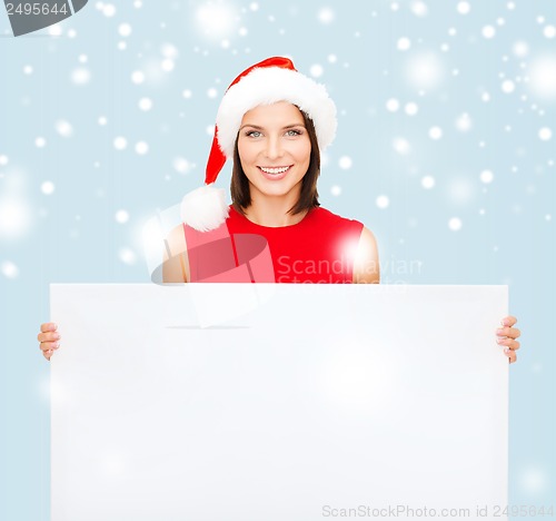 Image of woman in santa helper hat with blank white board
