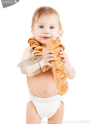Image of cute todler eating long bread
