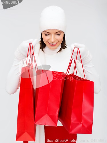 Image of picture of happy woman with shopping bags