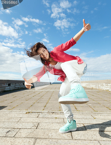 Image of beautiful dancing girl in movement