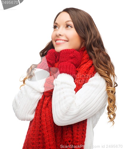 Image of woman in sweater, scarf and mittens