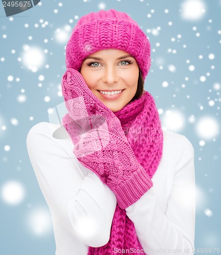 Image of woman in hat, muffler and mittens