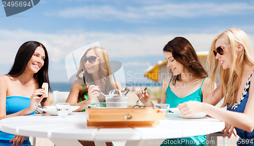 Image of girls in cafe on the beach