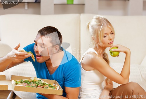 Image of couple eating different food