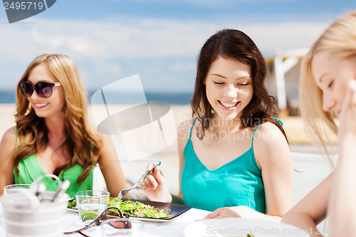 Image of girls in cafe on the beach