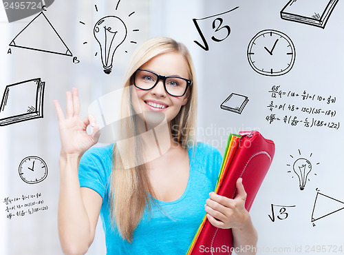 Image of smiling student with folders