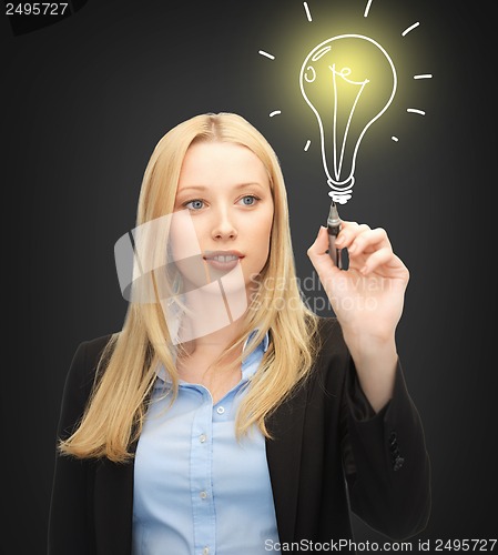 Image of woman drawing light bulb