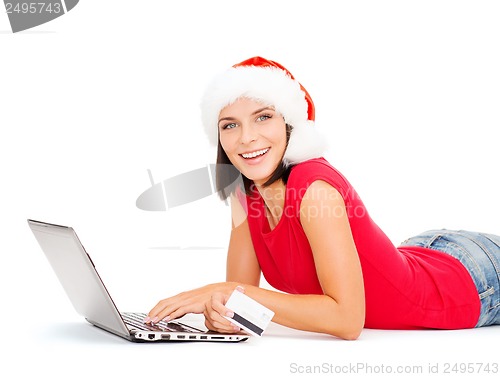 Image of santa helper woman with laptop and credit card