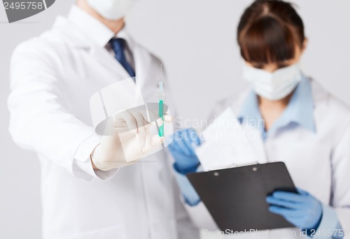 Image of doctors with syringe
