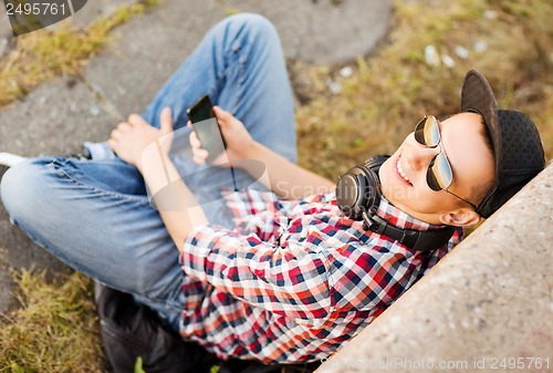 Image of girl with headphones and smartphone