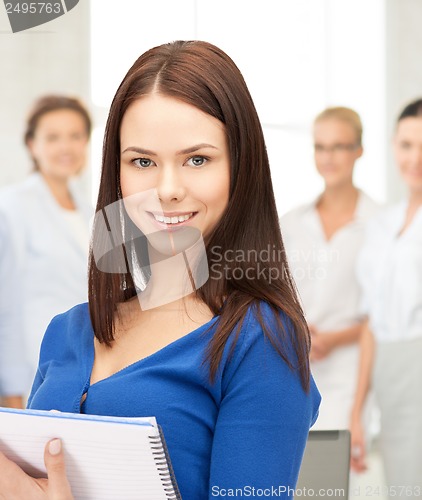 Image of happy woman with big notepad