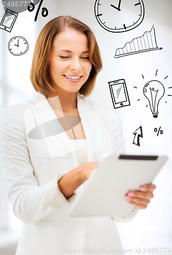 Image of businesswoman with tablet pc in office