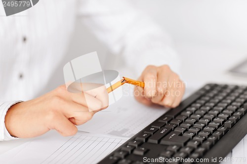 Image of woman breaking pencil