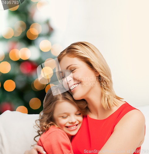 Image of hugging mother and daughter