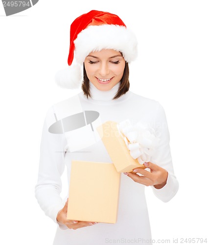 Image of smiling woman in santa helper hat with gift box