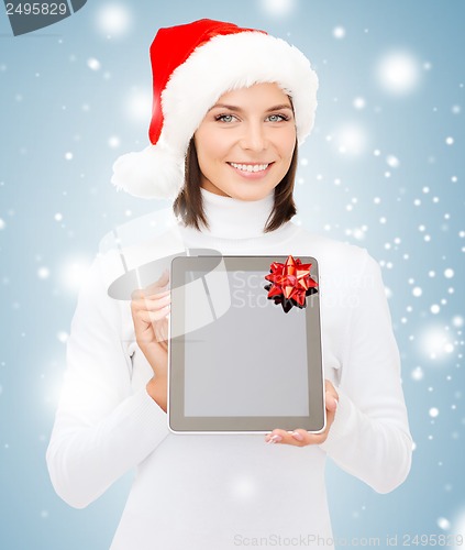 Image of woman in santa helper hat with tablet pc